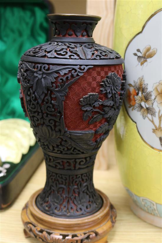 A pair of Chinese two colour carved lacquer vases and a Chinese yellow ground vase tallest 46cm